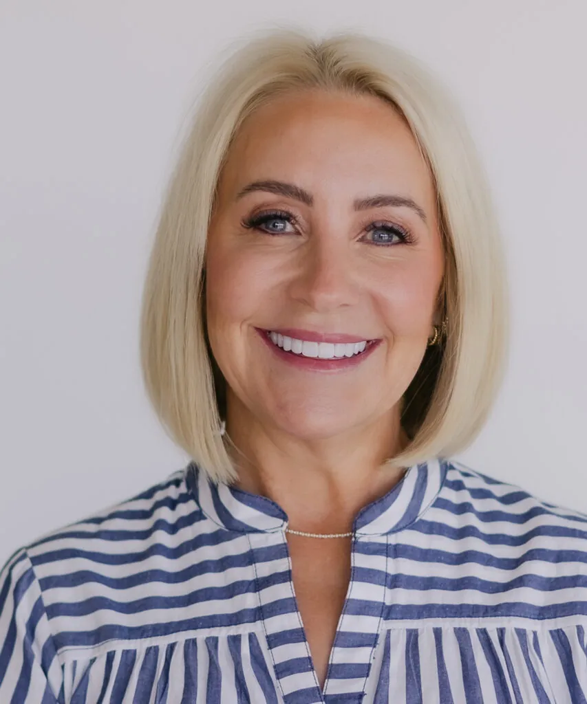 woman smiling after visiting Utah County implant dentistry